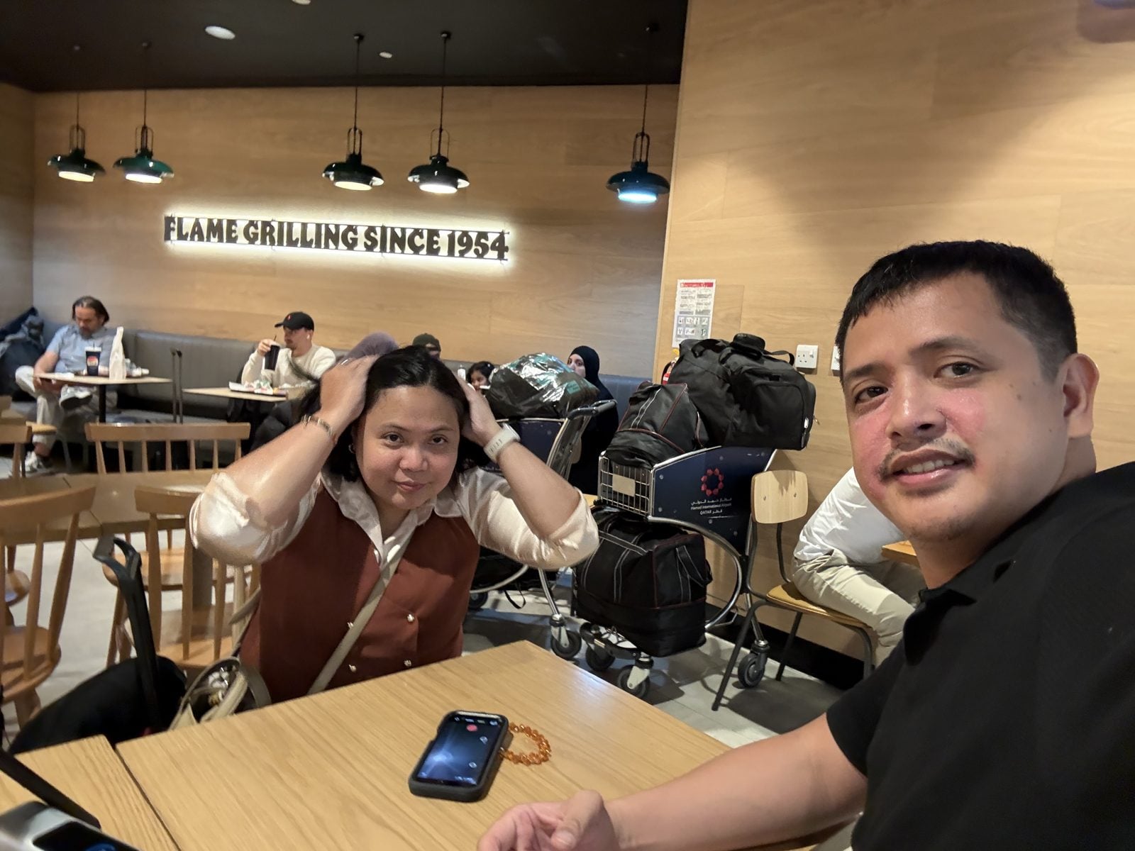 Paolo and Rosed at Burger King at Hamad International Airport, Doha