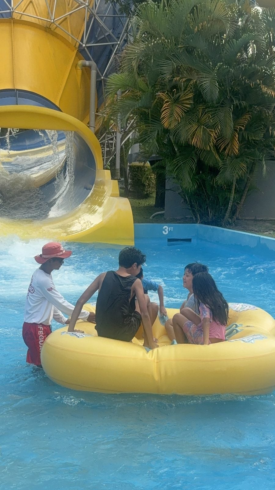 Splashdown! The kids landing together after a raft slide.