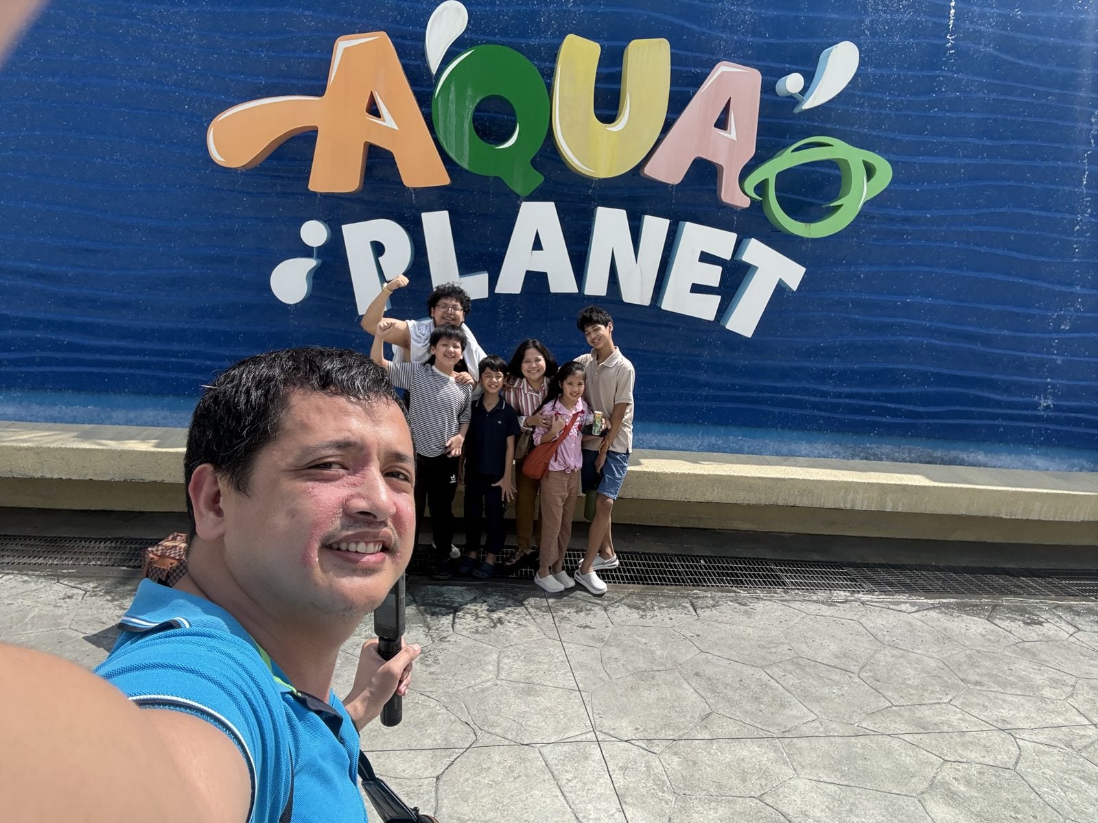 Selfie in front of the Aqua Planet sign