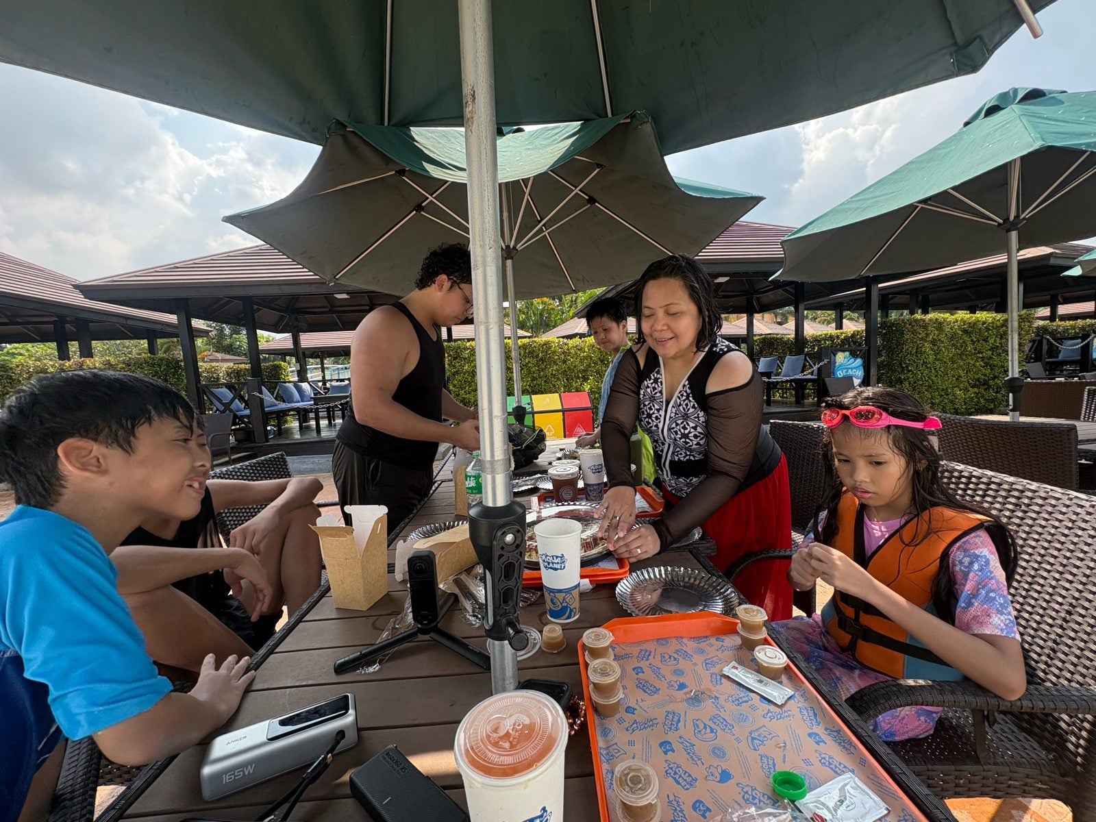 Family lunch under the umbrellas at Aqua Planet