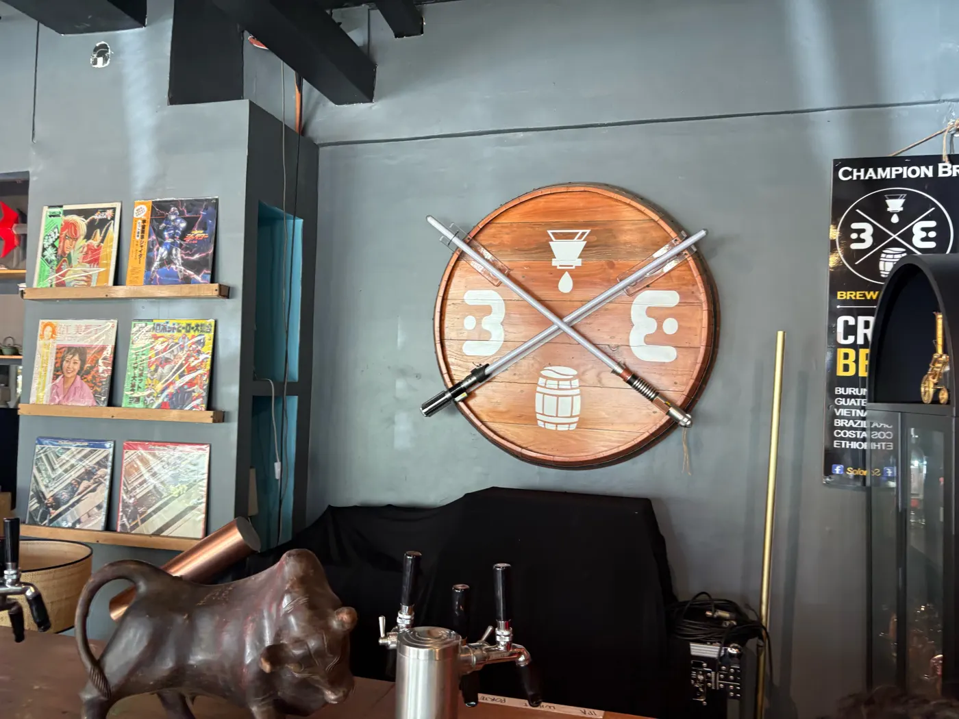 Barrel-top Brew and Barrel sign with crossed lightsabers above the beer taps in New Manila