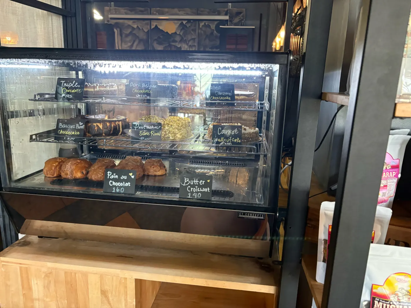 Pastry case with cheesecakes, croissants and pain au chocolat at Brew and Barrel New Manila