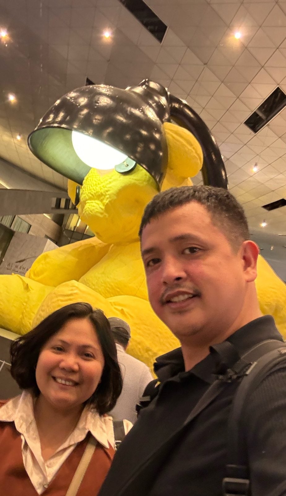 Paolo and Rosed with the Lamp Bear at Hamad International Airport, Doha
