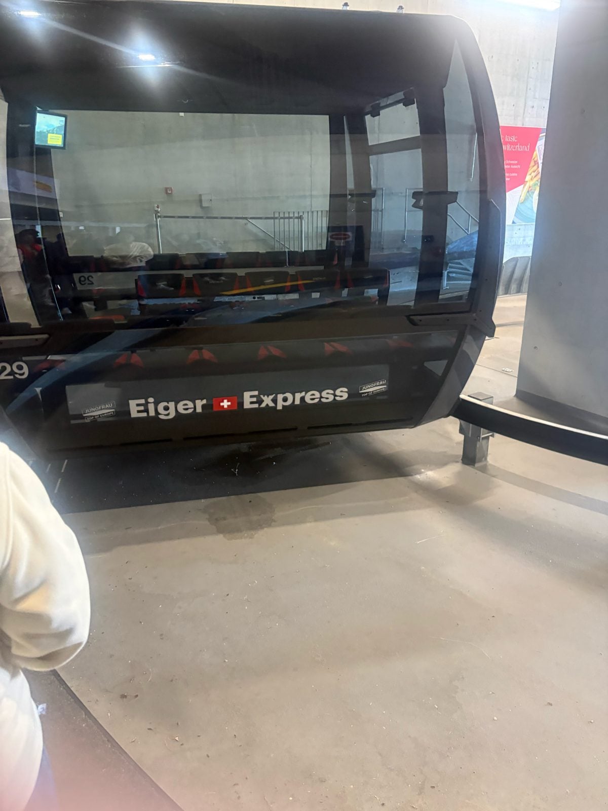 An Eiger Express gondola cabin waiting at the station
