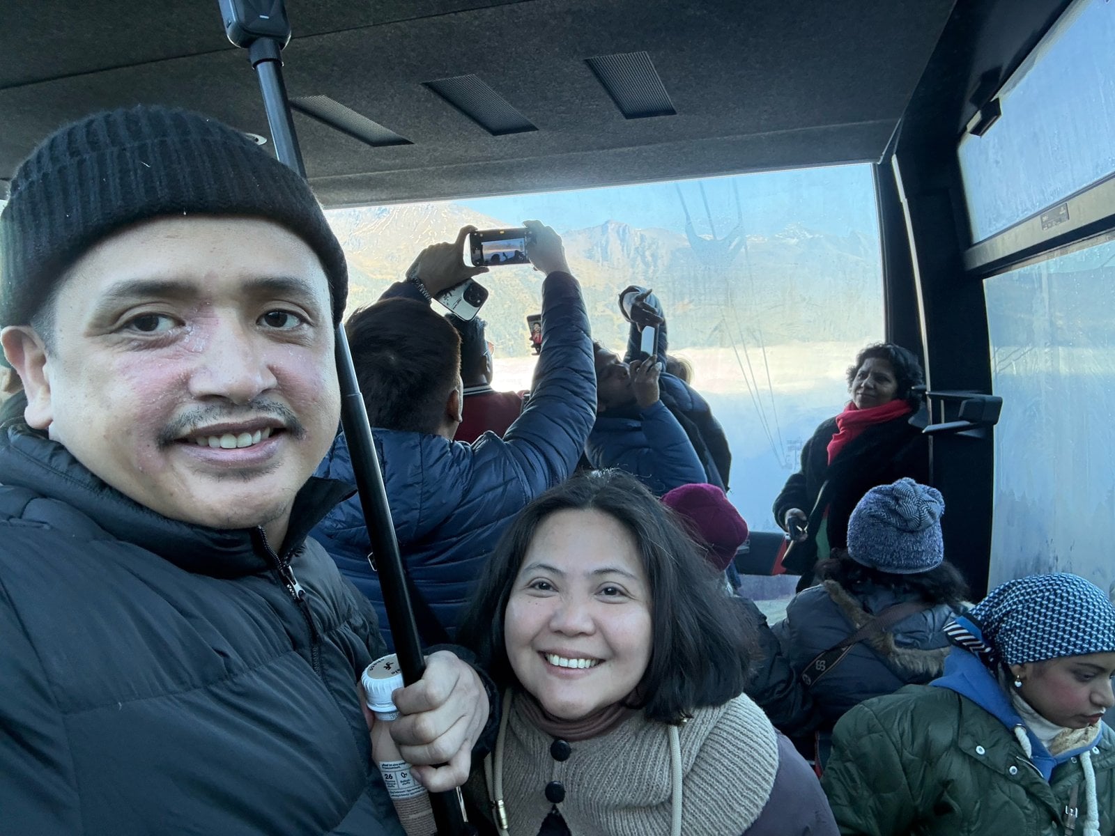 Gondola selfie with the peaks behind us