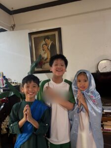 Sky and Chloe in costume with their older brother
