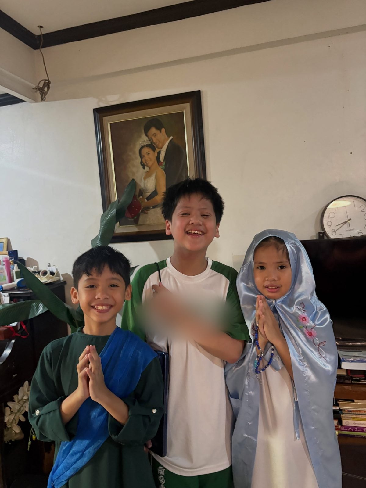 Sky and Chloe in costume with their older brother
