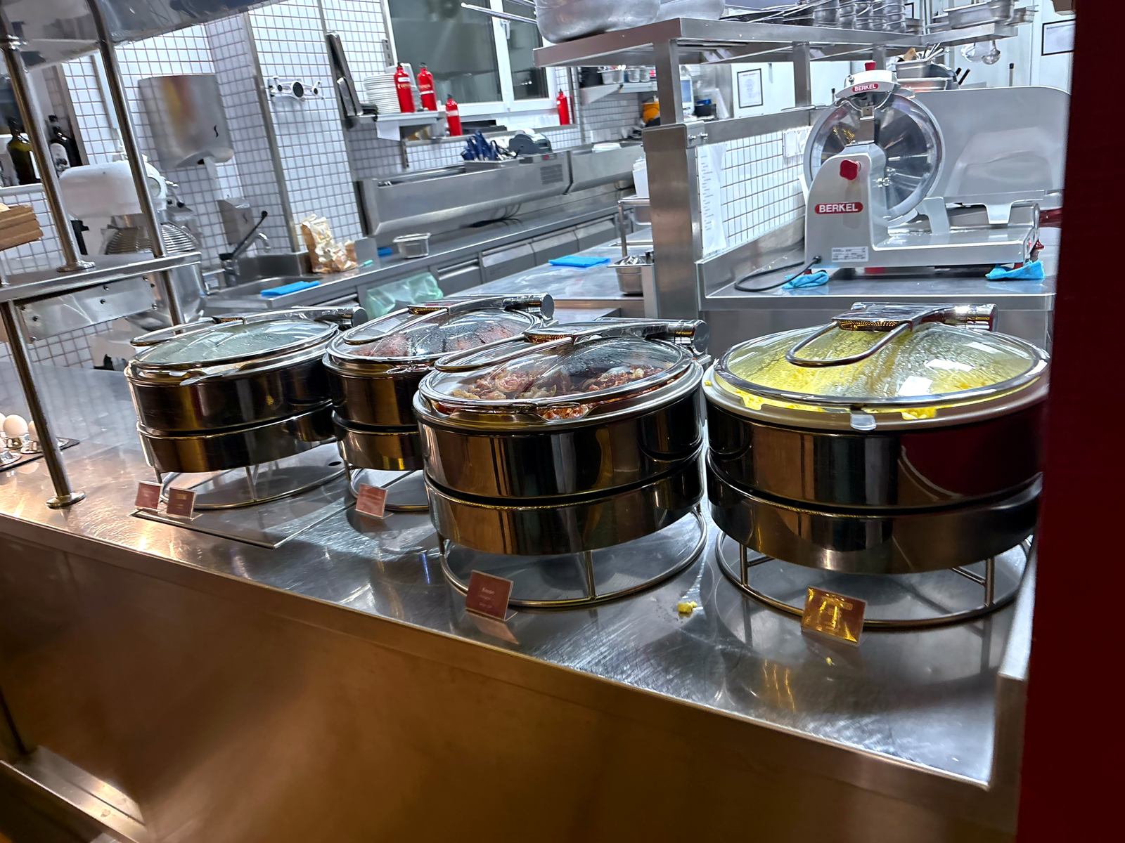 Covered chafing dishes of hot breakfast food at Luigia Opfikon