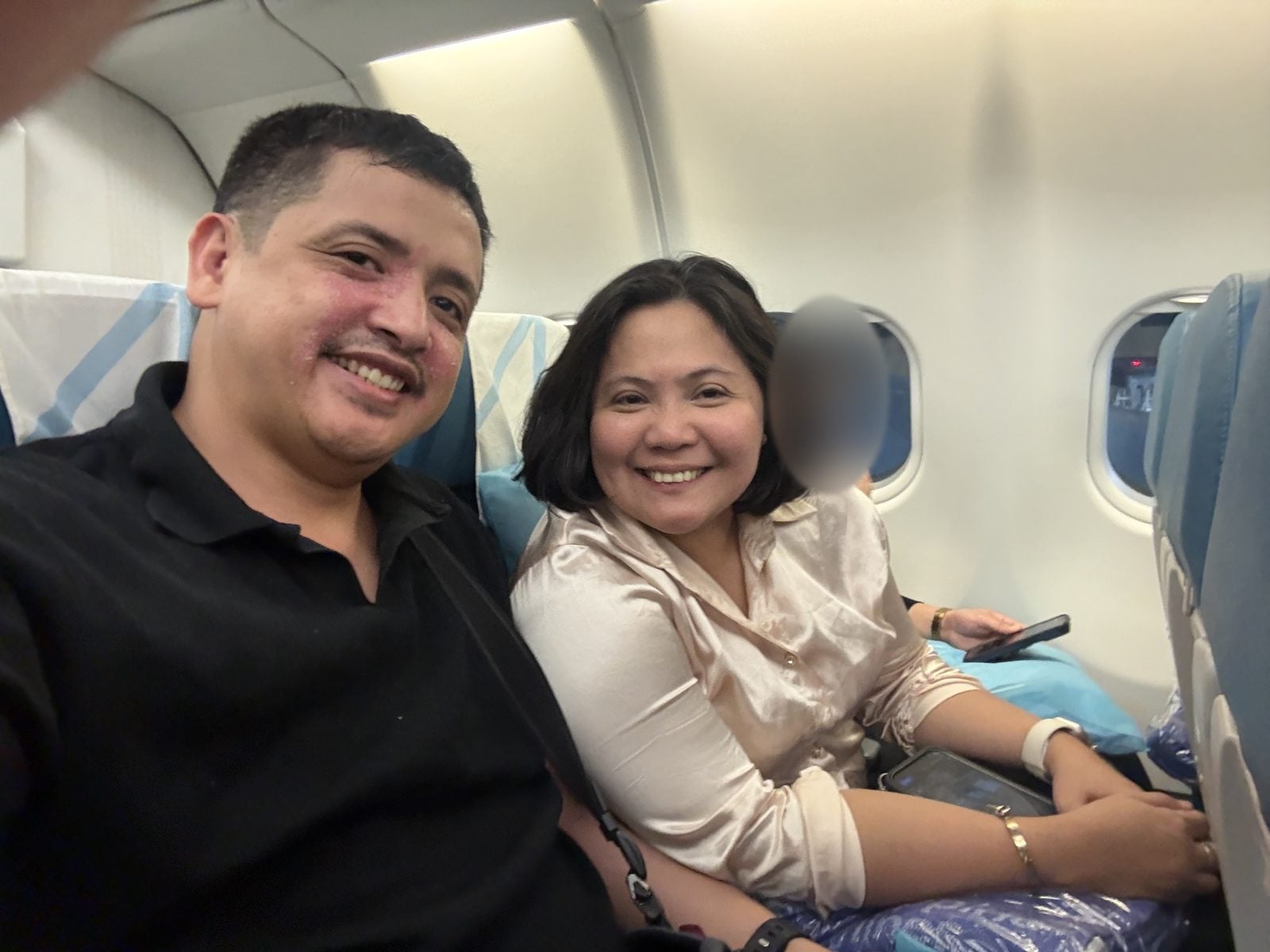 Paolo and Rosed on board the flight from Manila to Doha