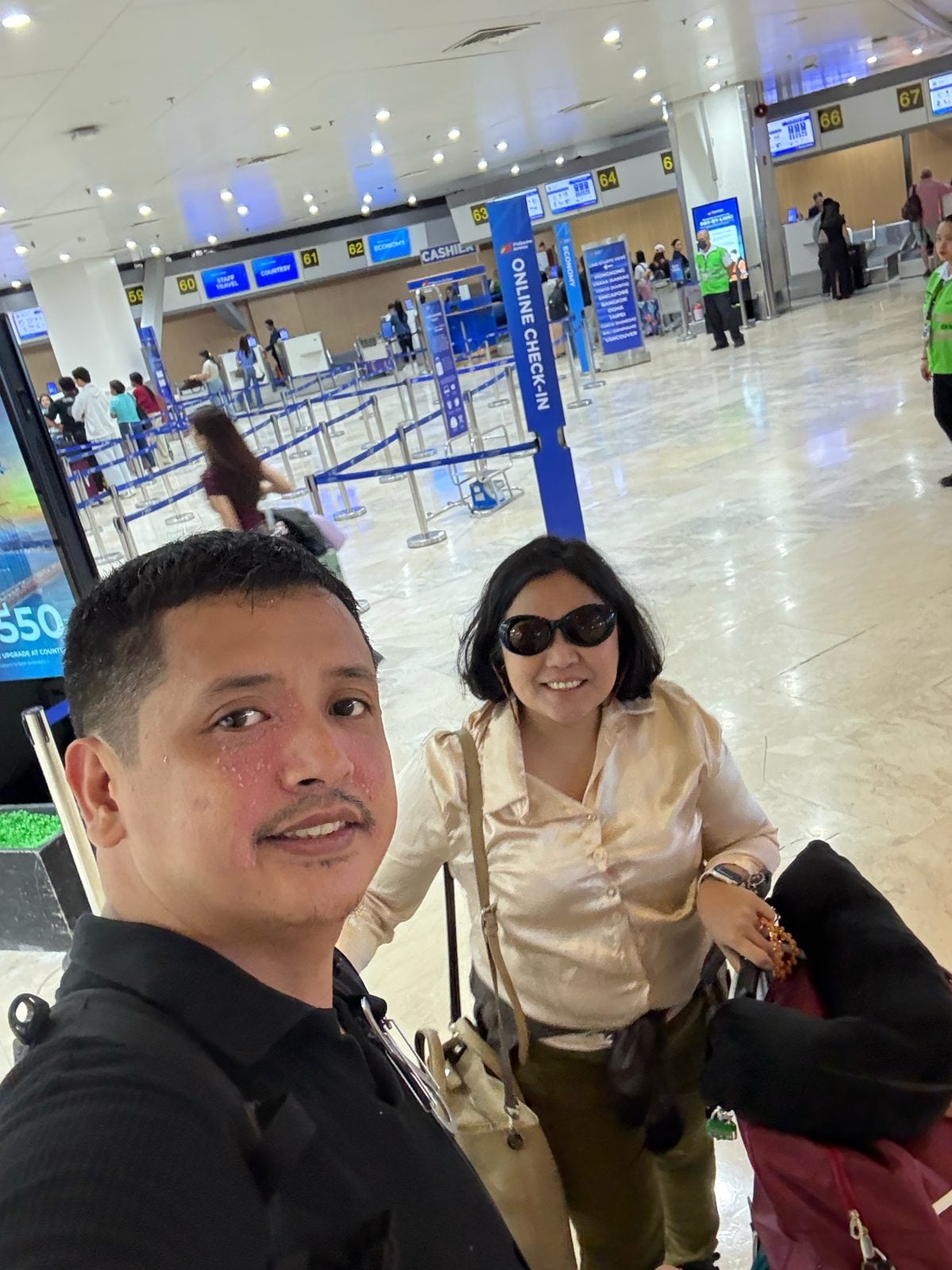 Paolo and Rosed selfie at the Philippine Airlines check-in area at NAIA Terminal 1, Manila