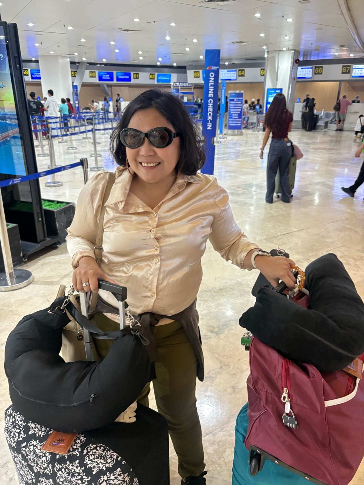 Rosed with our bags at check-in at NAIA Terminal 1, Manila