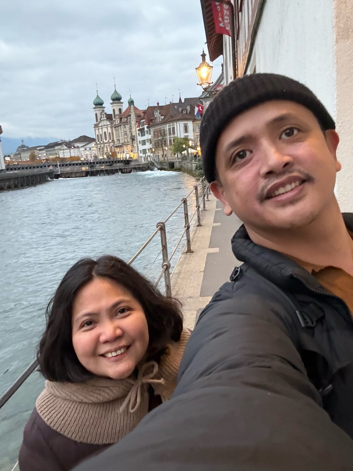 Selfie by the Reuss river with the Jesuit Church domes in Lucerne