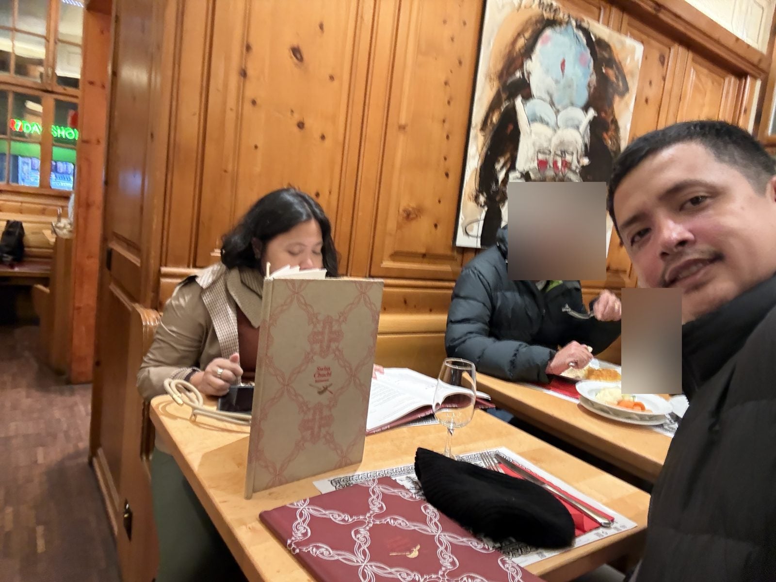 Reading the menu at Swiss Chuchi in Hotel Adler, Zurich