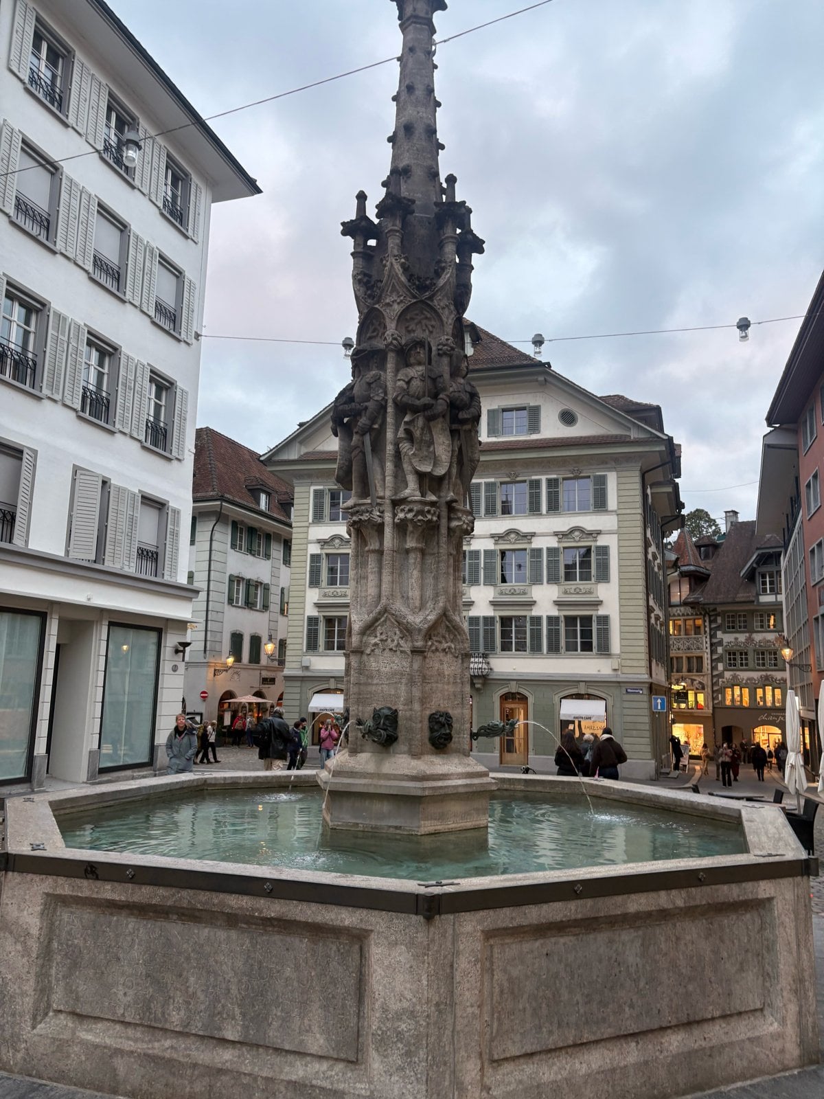 Carved stone figures on the Weinmarkt fountain in Lucerne