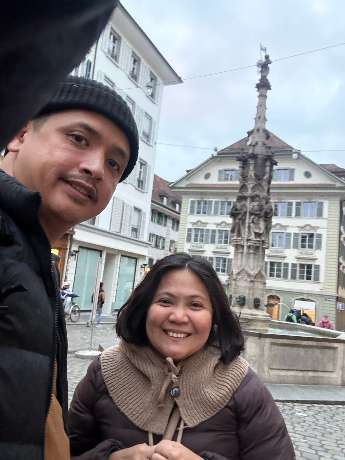 Paolo and Dimple at the Weinmarkt fountain in Lucerne Old Town