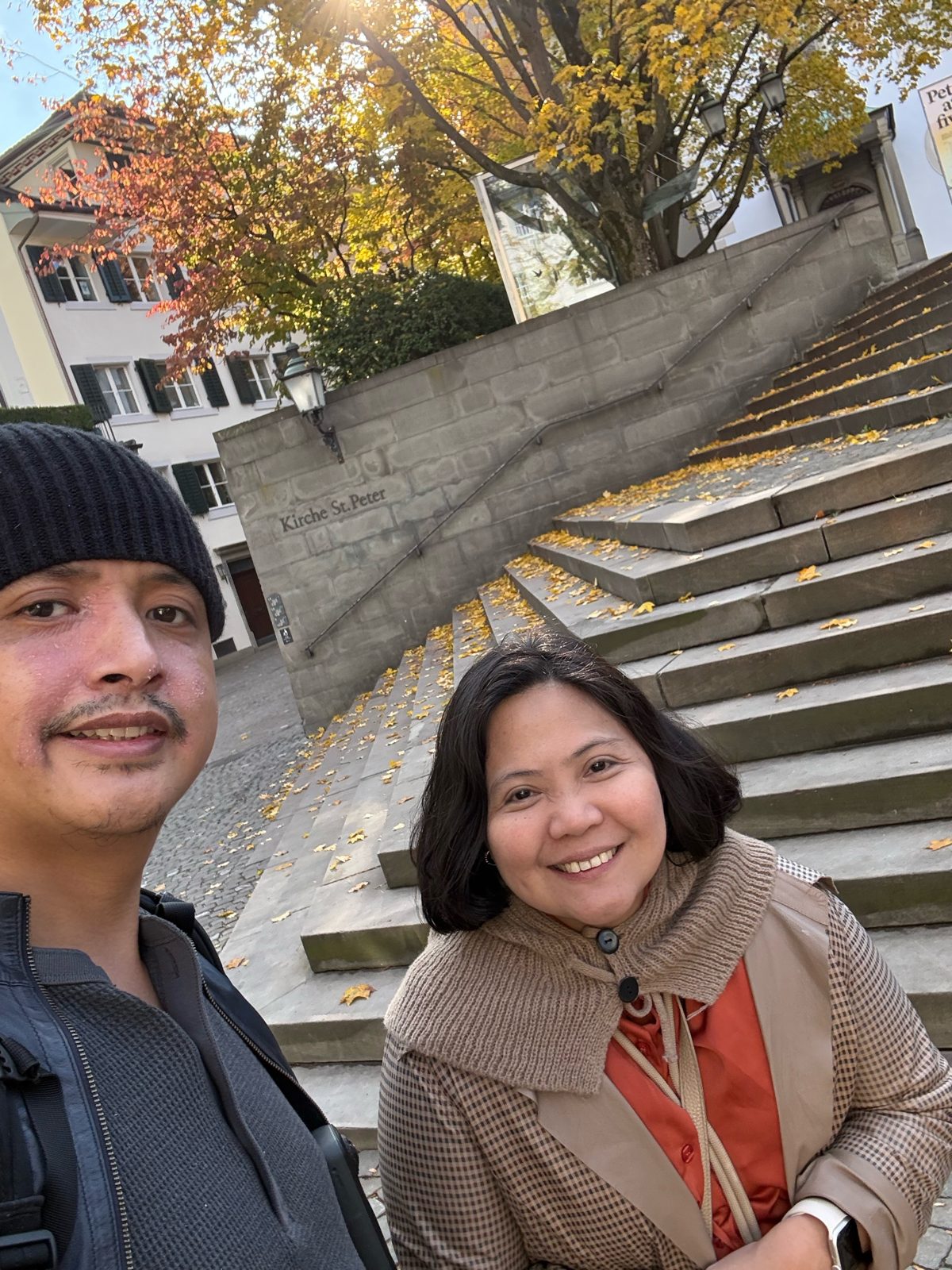Paolo and Dimple on the leaf-covered Kirche St. Peter stairs