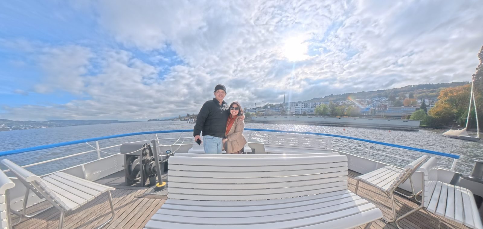 Paolo and Dimple on the open front deck of a Lake Zurich boat