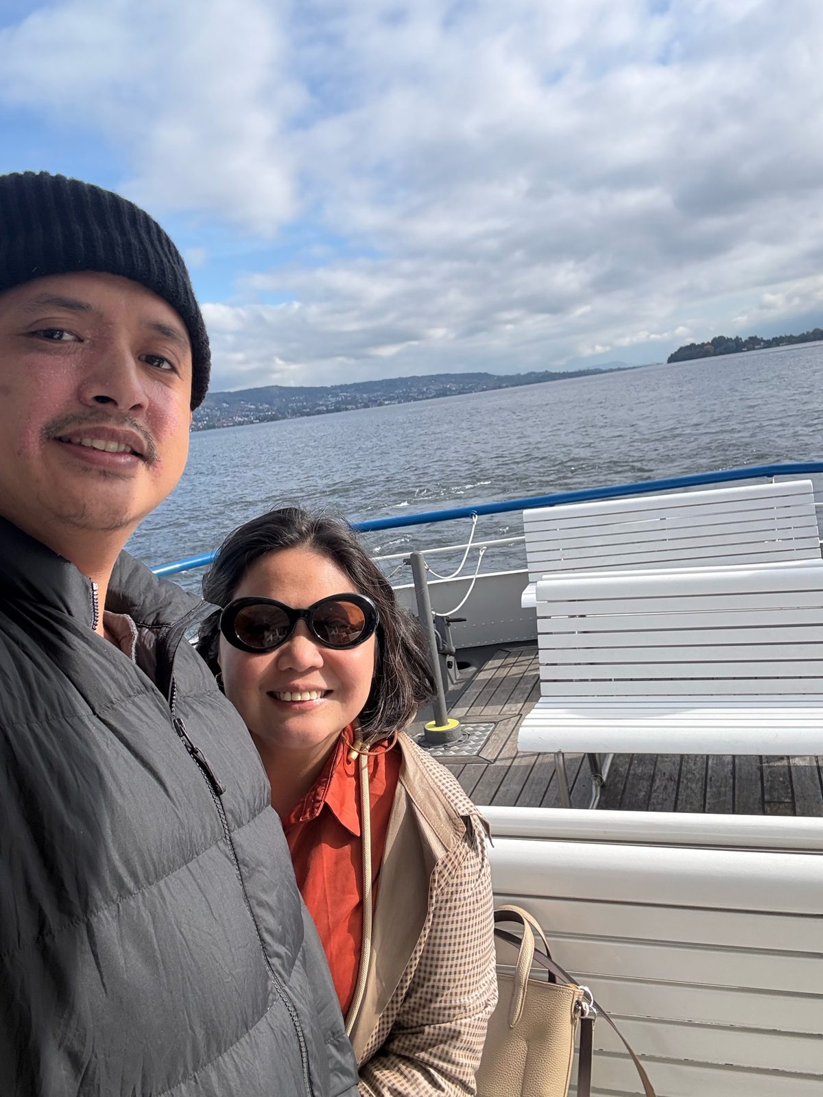 Selfie on deck with the hills across Lake Zurich