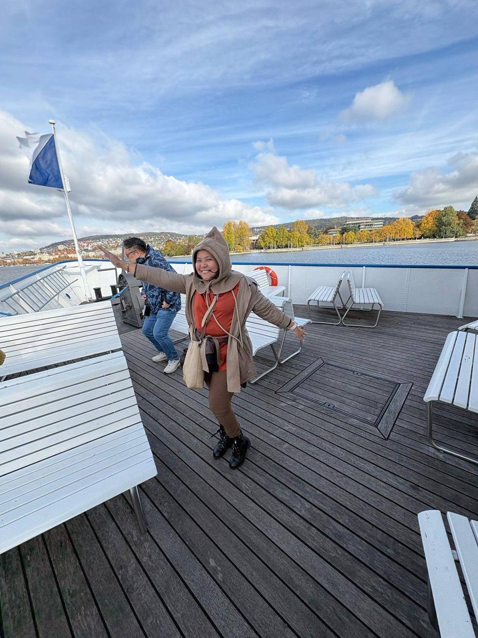 Dimple threw her arms out like she owned the deck. The wind didn't stop her.