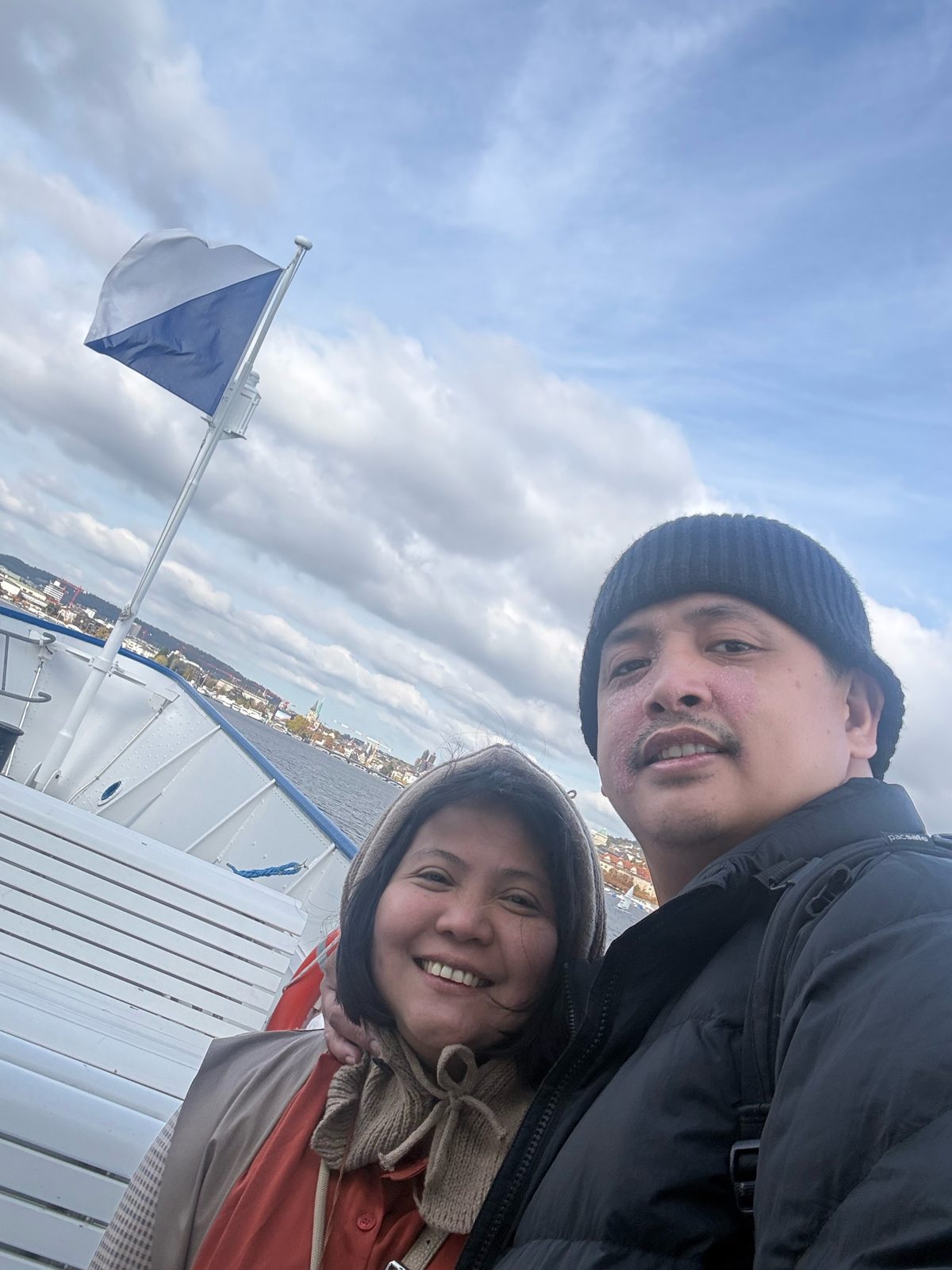 A selfie under the Zurich flag, with the old town behind us.