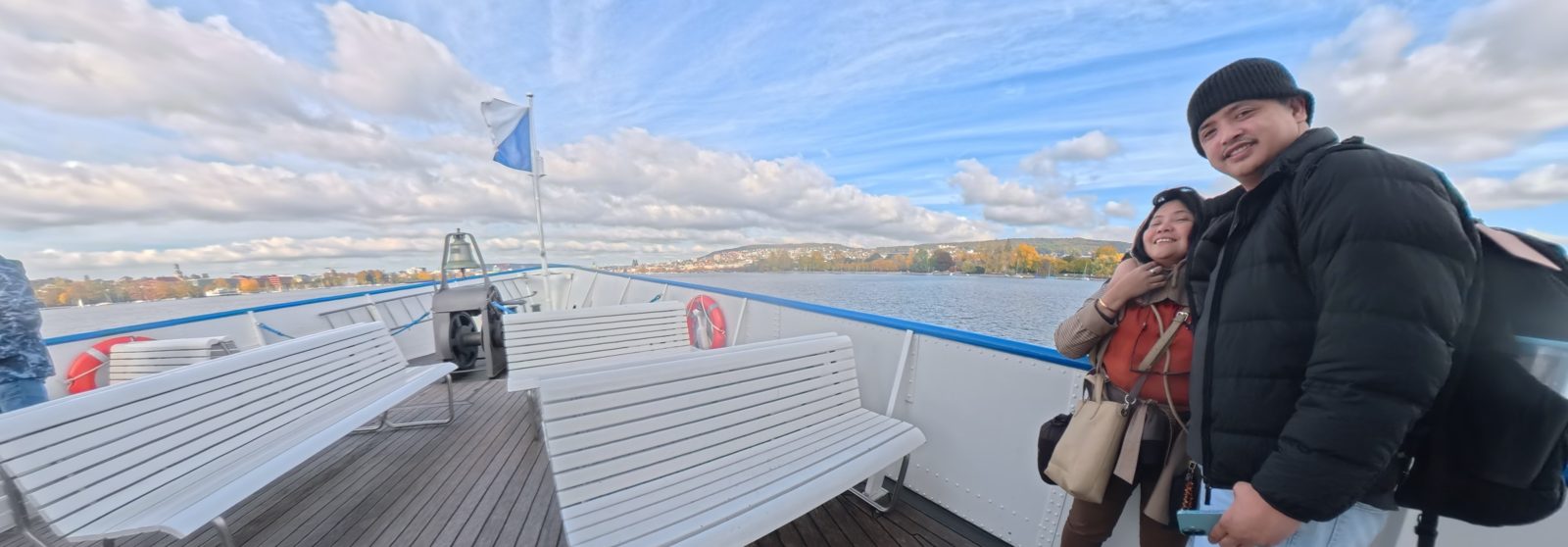 Out on the open deck, with Lake Zurich and the autumn shoreline behind us.