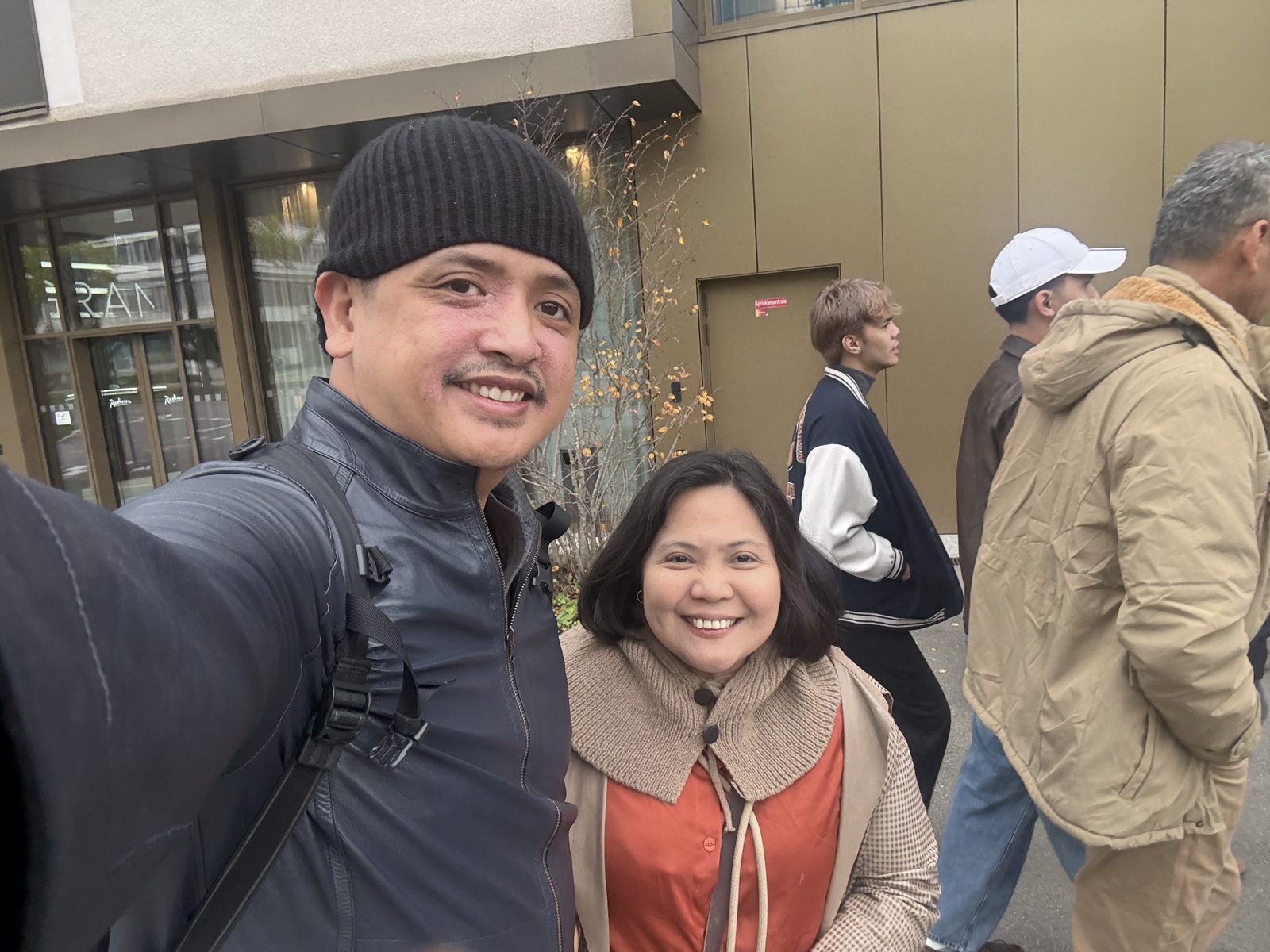 Paolo and Dimple outside Radisson Hotel & Suites Zurich at the start of the walking tour